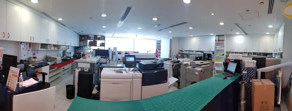 Wide view of the Flying Colours studio with printers and finishing stations